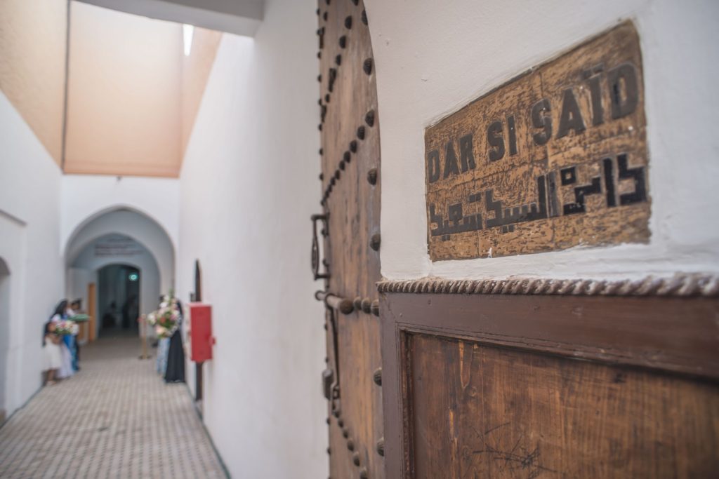 Arched stone corridor inside the Dar Si Said Museum of Moroccan Arts in Marrakech