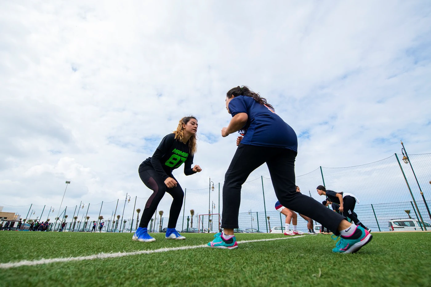 Women's rugby team The Moroccan Mavericks training on a coastal pitch, from Bakir Mohammed's sports documentary series.